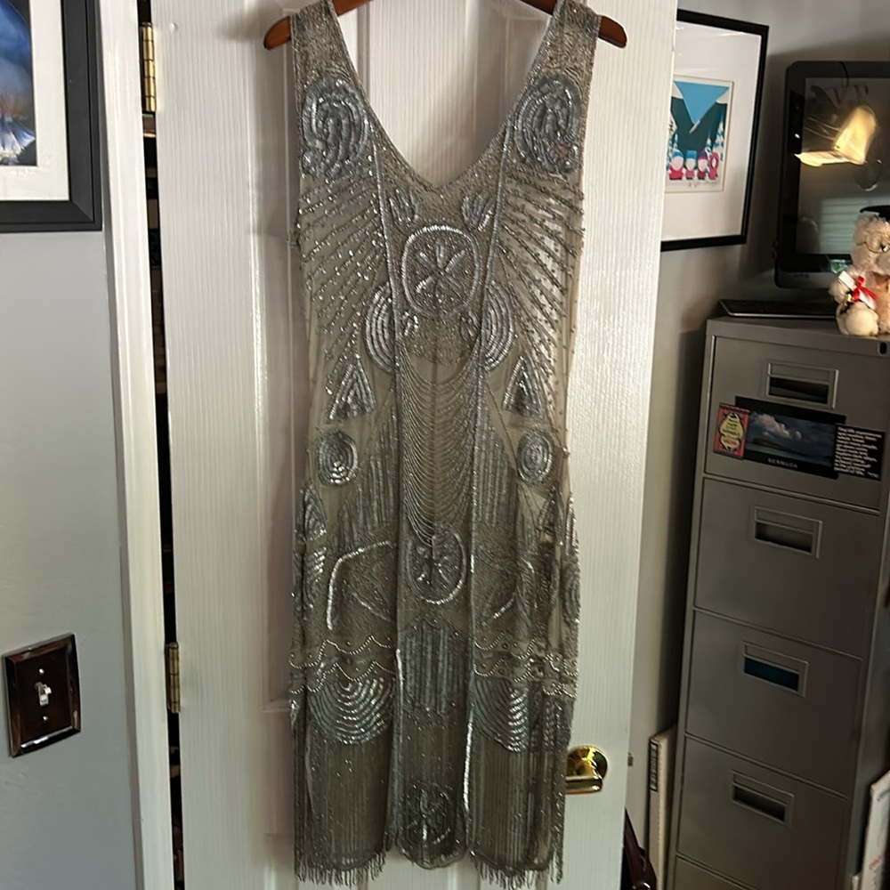 Ready to join the flappers in this amazing hand beaded stretch dress!